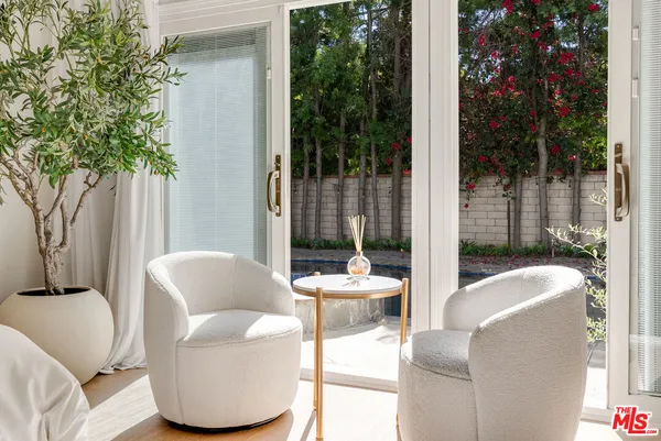 a outdoor living space with furniture and a potted plant