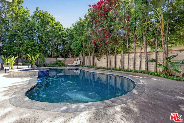 a view of a swimming pool with a patio