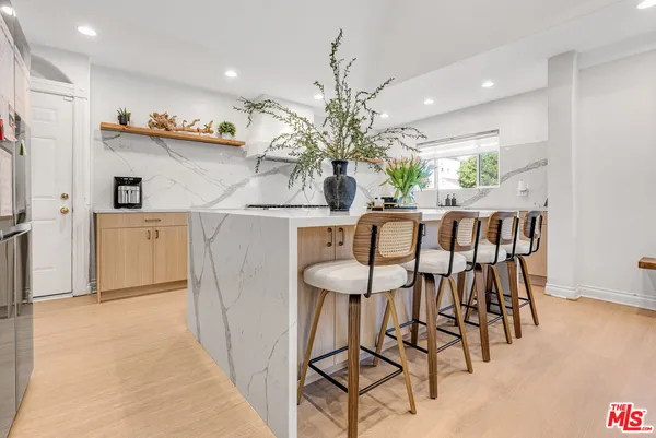 a dining room with furniture and chandelier