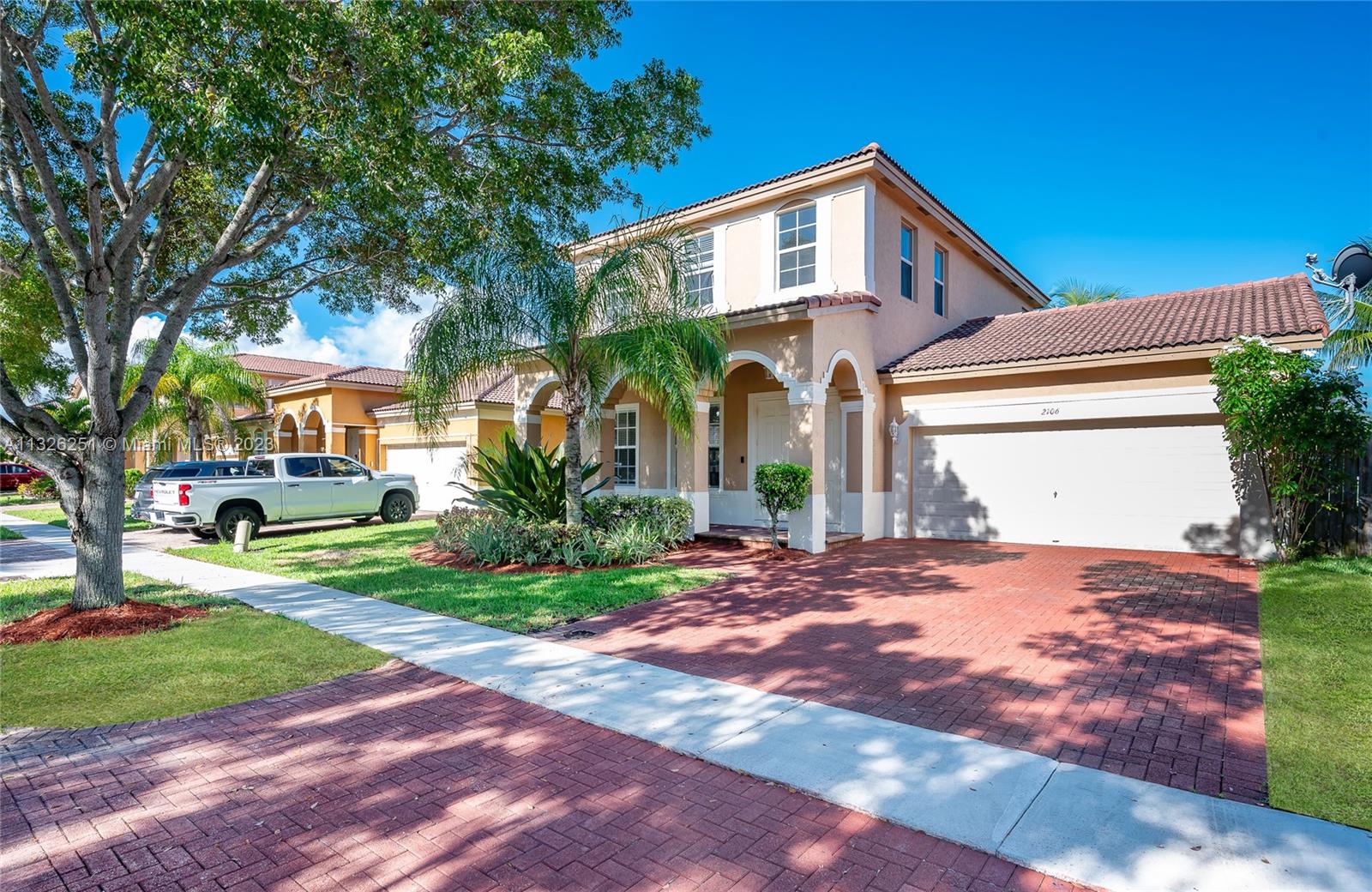 2106 Northeast 40th Road Homestead, FL 33033 - Photo 1 of 33 a front view of a house with a yard