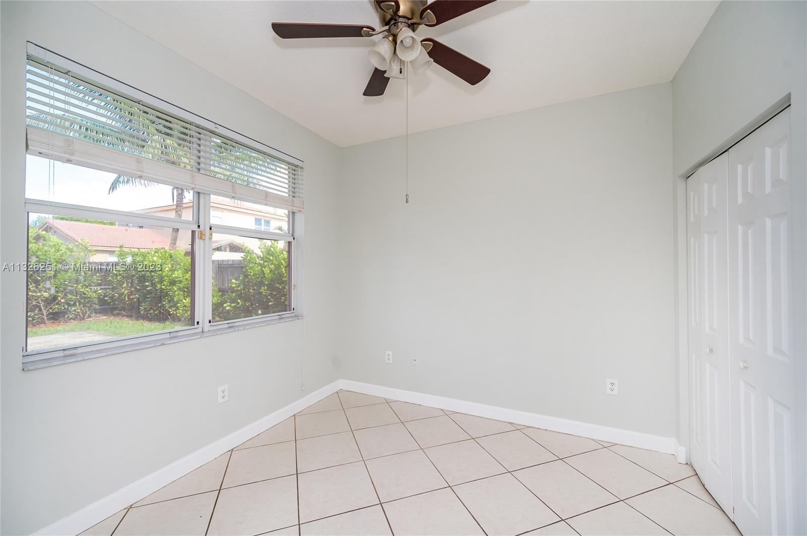 2106 Northeast 40th Road Homestead, FL 33033 - Photo 13 of 33 a view of an empty room with a window