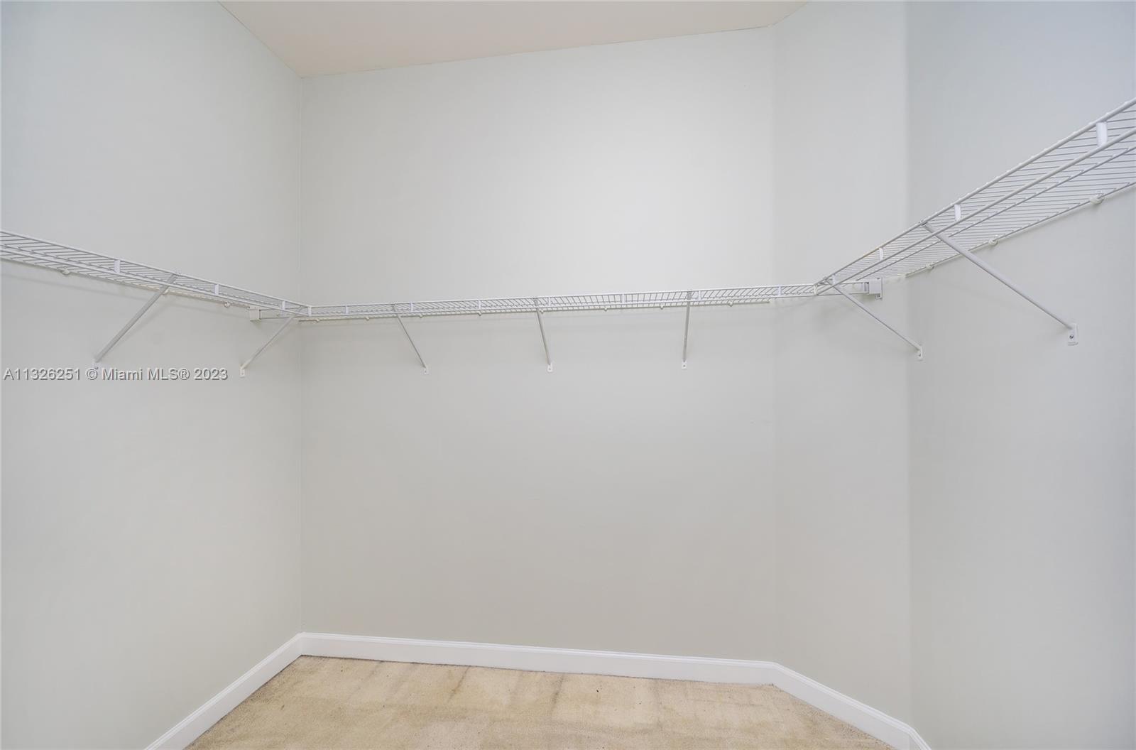 2106 Northeast 40th Road Homestead, FL 33033 - Photo 19 of 33 a view of an empty walk in closet