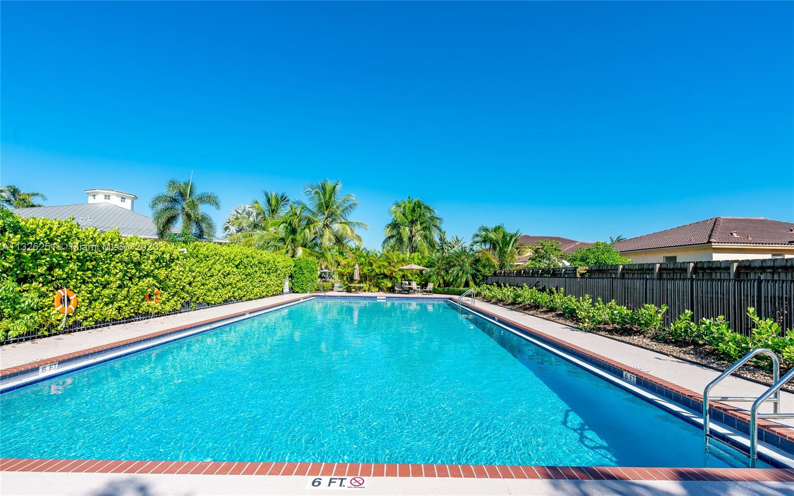 2106 Northeast 40th Road Homestead, FL 33033 - Photo 28 of 33 a view of a swimming pool with a yard