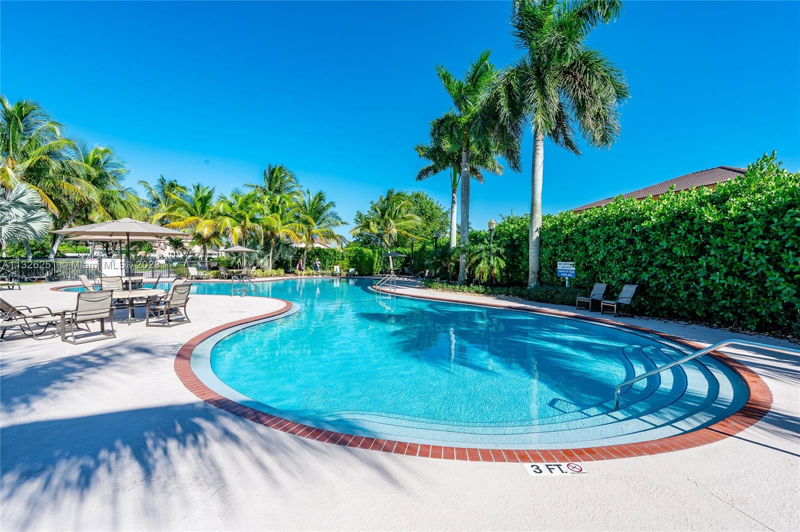 2106 Northeast 40th Road Homestead, FL 33033 - Photo 29 of 33 a view of a swimming pool with a sitting space