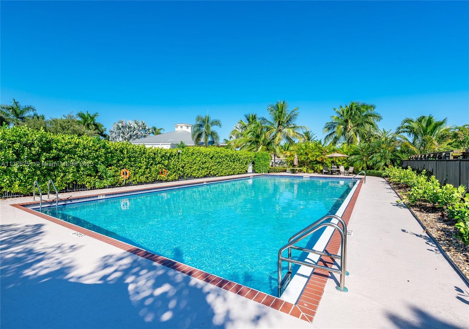 2106 Northeast 40th Road Homestead, FL 33033 - Photo 30 of 33 a view of a swimming pool with a yard