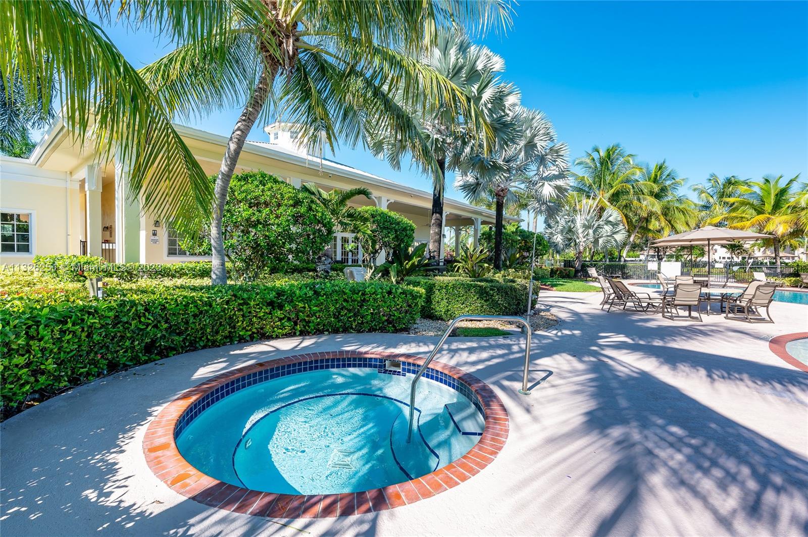 2106 Northeast 40th Road Homestead, FL 33033 - Photo 31 of 33 a view of a swimming pool with a garden