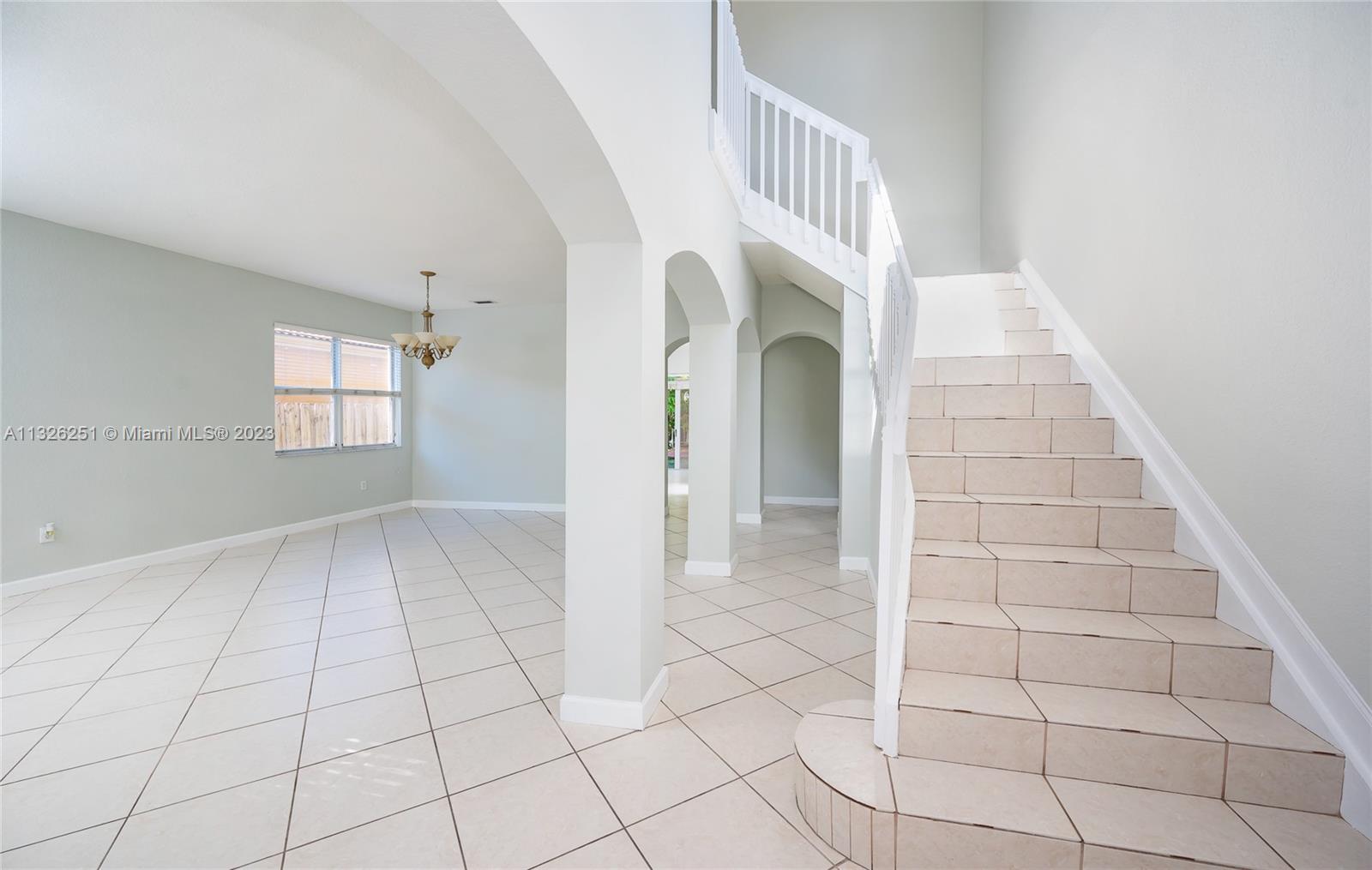 2106 Northeast 40th Road Homestead, FL 33033 - Photo 5 of 33 a view of an entryway with a window
