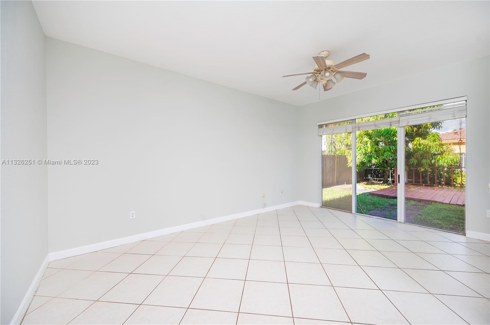 2106 Northeast 40th Road Homestead, FL 33033 - Photo 6 of 33 a view of an empty room with a window