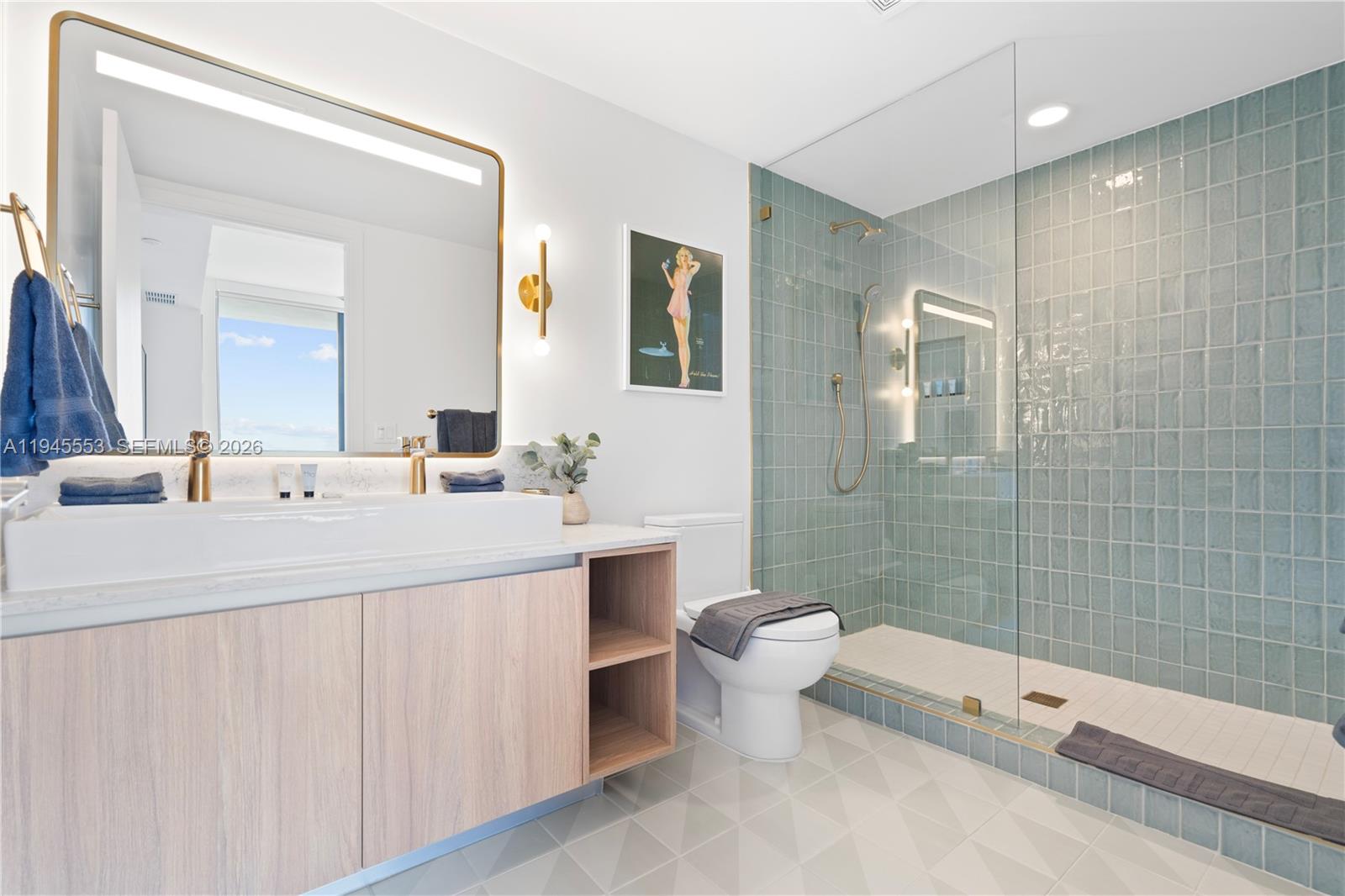 159 Northeast 6th Street, Unit 2415 Miami, FL 33132 - Photo 2 of 42 a bathroom with a double vanity sink toilet and shower