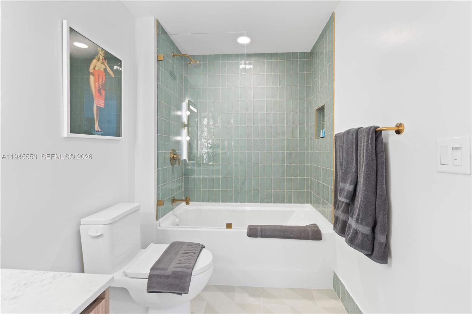 159 Northeast 6th Street, Unit 2415 Miami, FL 33132 - Photo 21 of 42 a bathroom with a bathtub and a shower