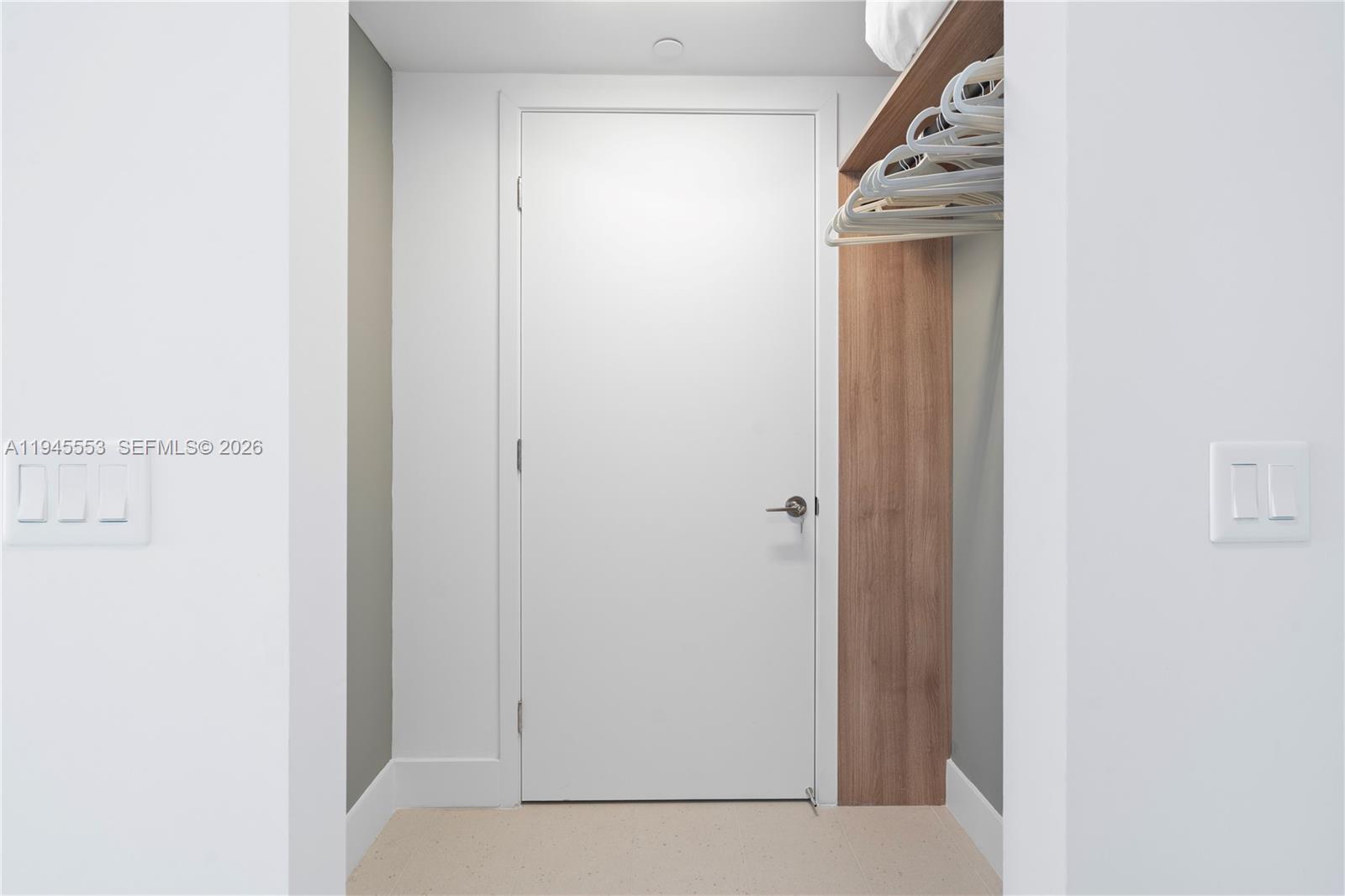 159 Northeast 6th Street, Unit 2415 Miami, FL 33132 - Photo 3 of 42 a view of a hallway with wooden floor