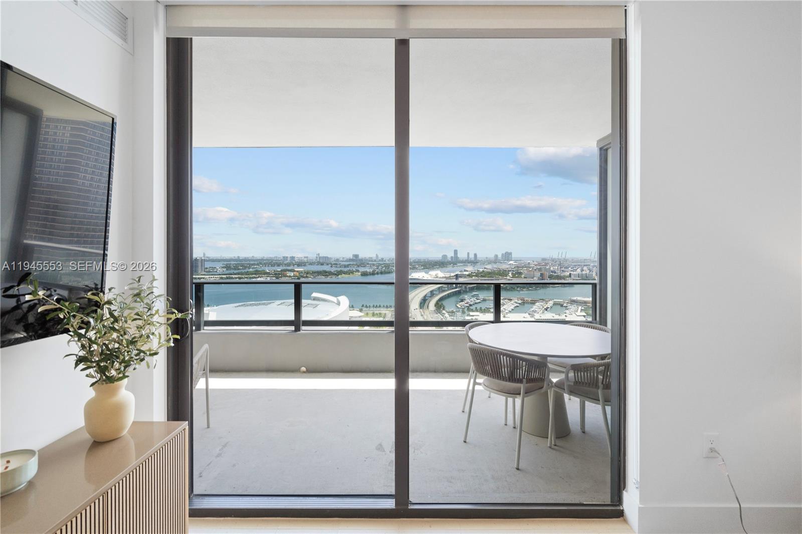 159 Northeast 6th Street, Unit 2415 Miami, FL 33132 - Photo 35 of 42 a living room with furniture and a potted plant