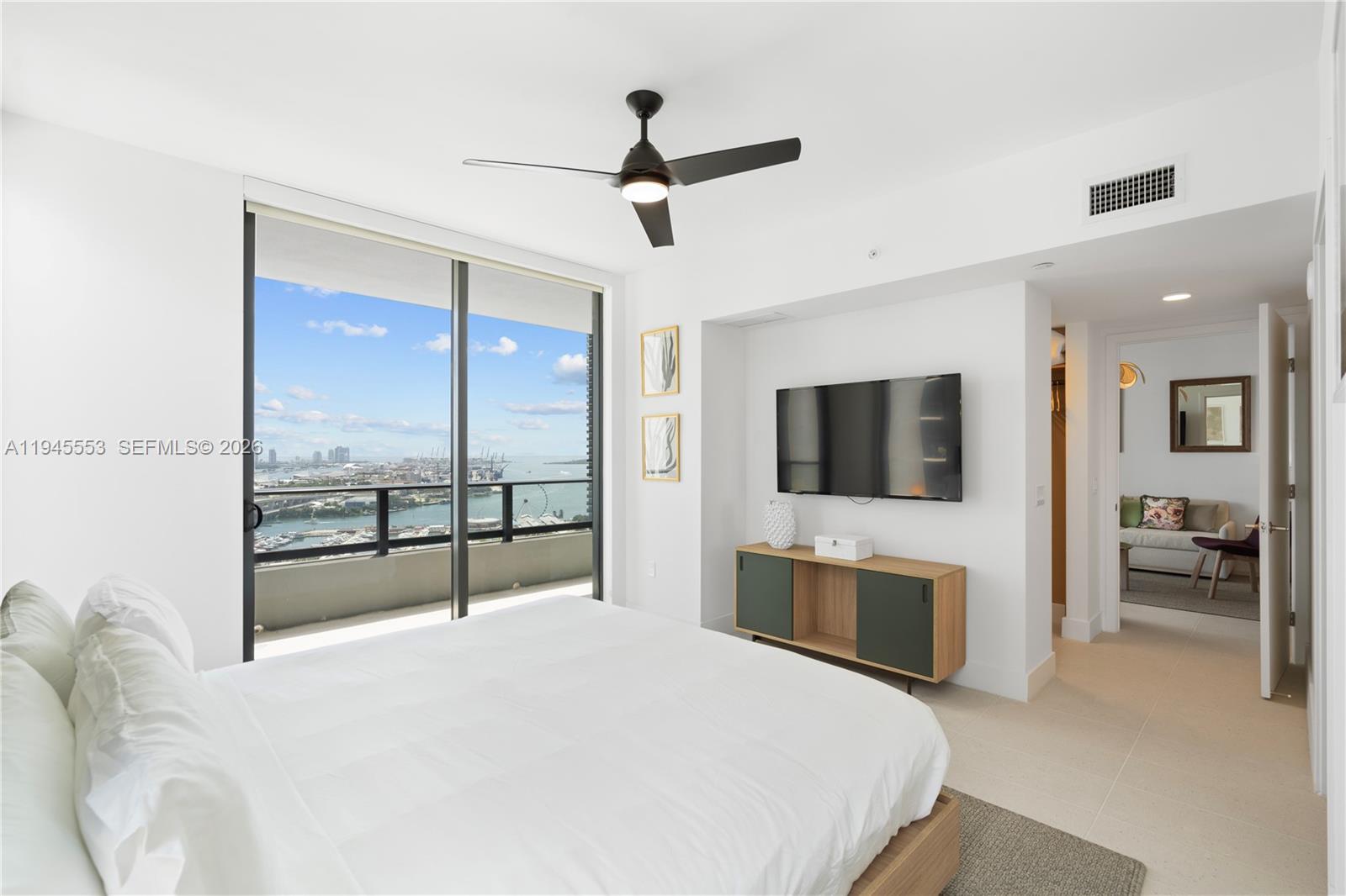 159 Northeast 6th Street, Unit 2415 Miami, FL 33132 - Photo 6 of 42 a bedroom with a bed and a large window