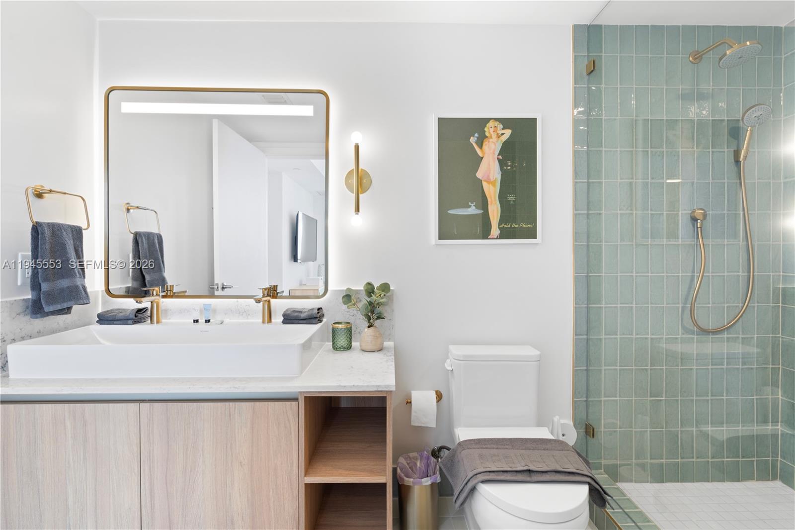 159 Northeast 6th Street, Unit 2415 Miami, FL 33132 - Photo 8 of 42 a bathroom with a sink a toilet and shower