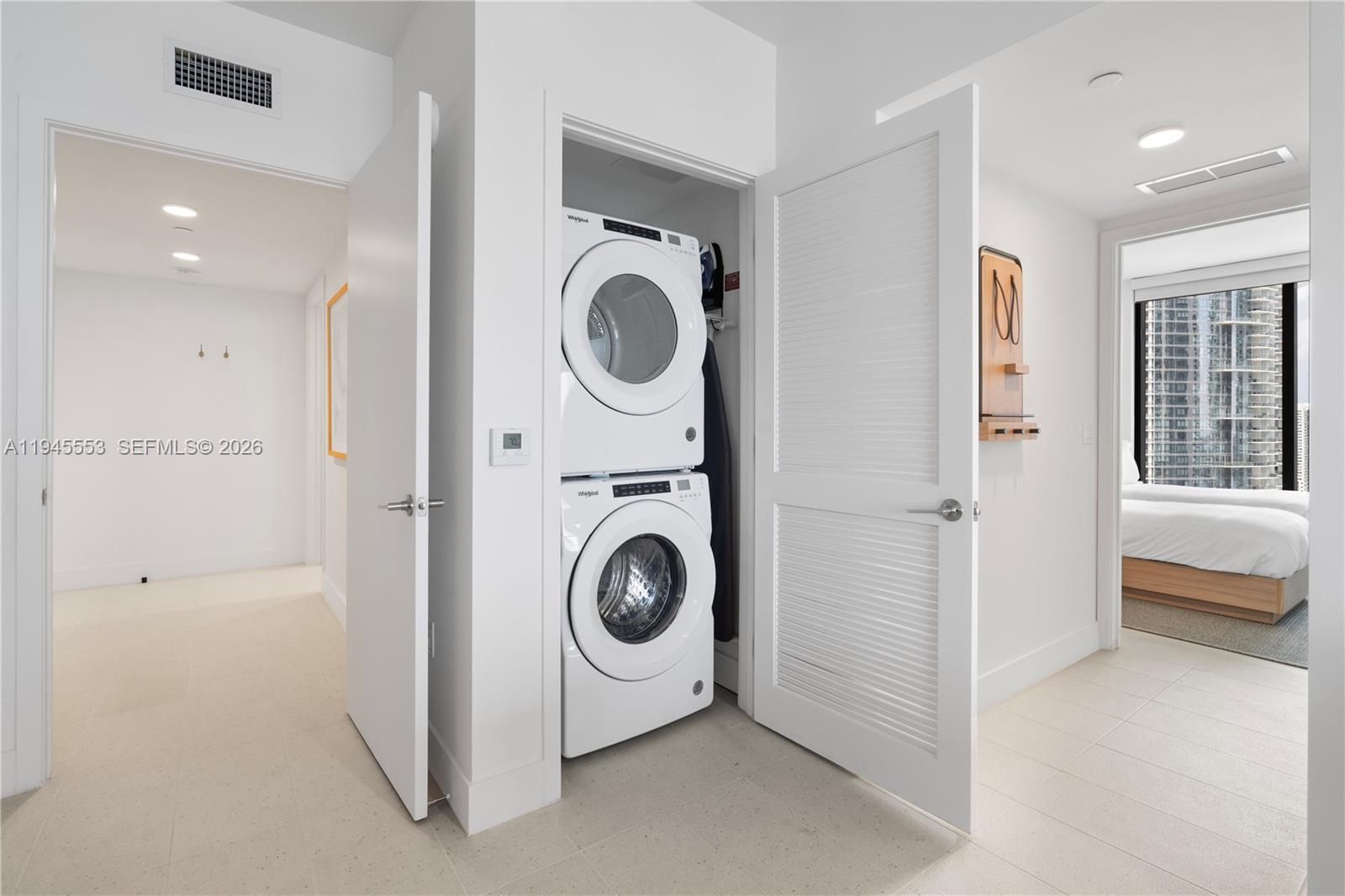159 Northeast 6th Street, Unit 2415 Miami, FL 33132 - Photo 9 of 42 a utility room with dryer and washer