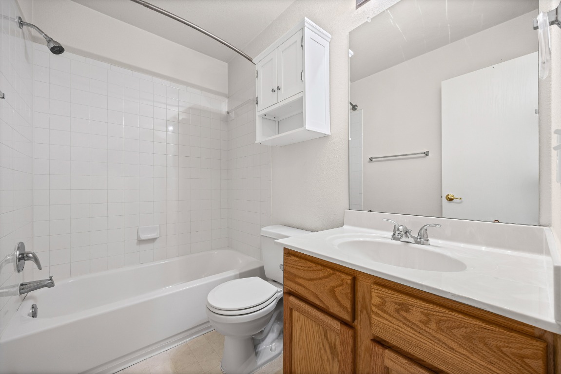 336 Celery Loop Austin, TX 78748 - Photo 21 of 32 Bathroom with shower / washtub combination and vanity