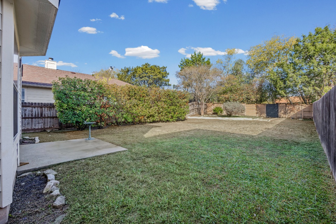 336 Celery Loop Austin, TX 78748 - Photo 24 of 32 Fenced backyard featuring a patio