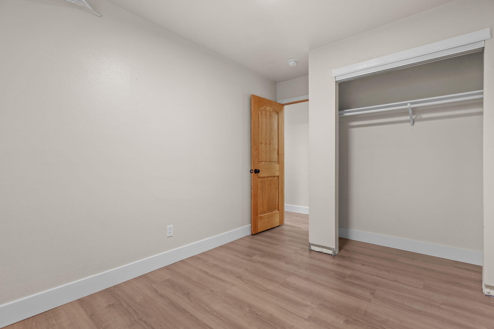 2132 Reta Way Red Bluff, CA 96080 - Photo 12 of 43 a view of an empty room with wooden floor