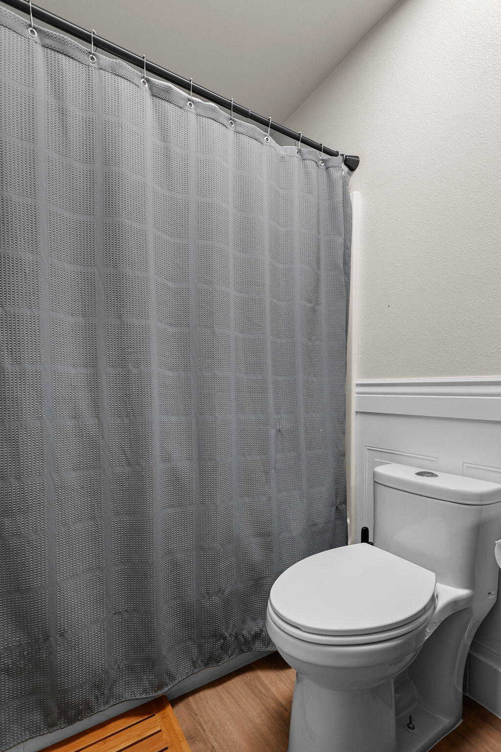2132 Reta Way Red Bluff, CA 96080 - Photo 14 of 43 a bathroom with a white toilet and a shower curtain