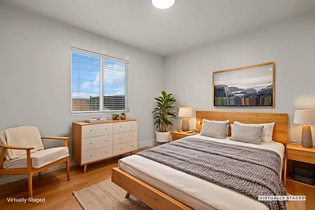 a bedroom with a bed and a dresser