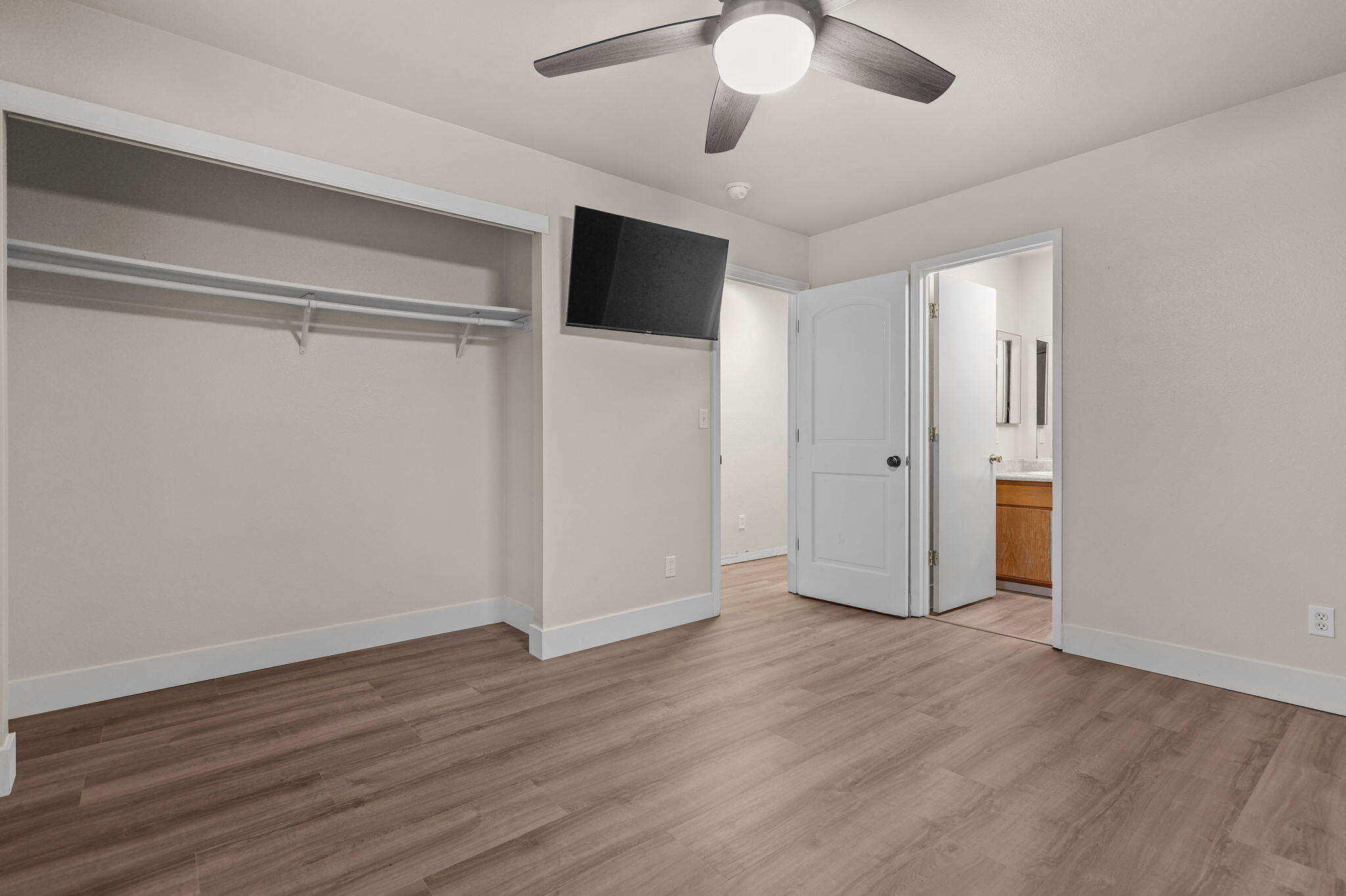 2132 Reta Way Red Bluff, CA 96080 - Photo 22 of 43 a view of an empty room with wooden floor