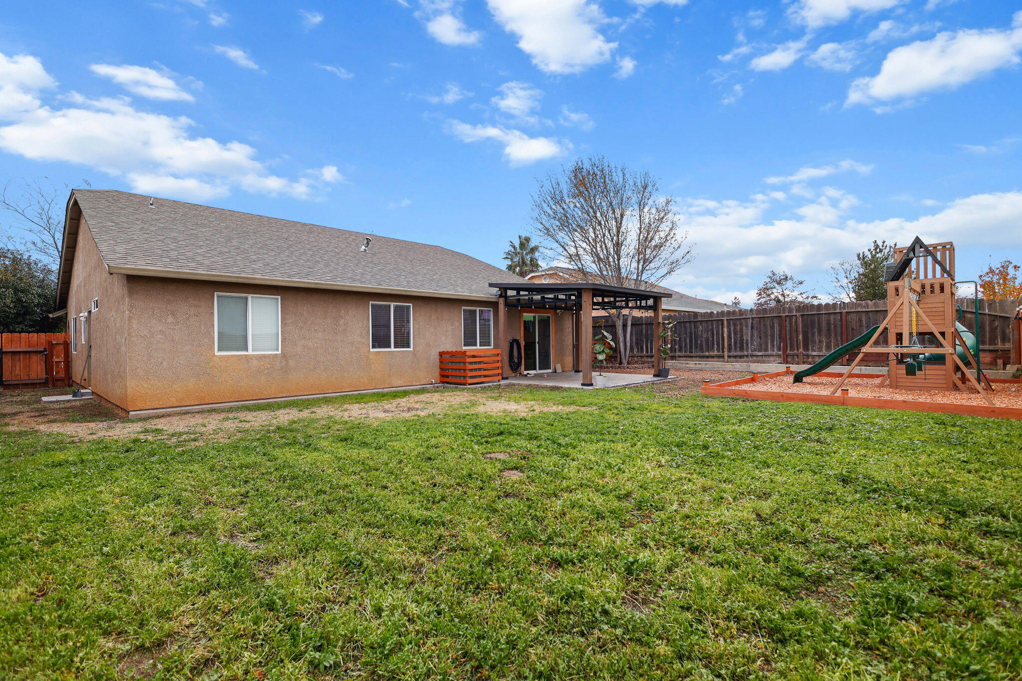 2132 Reta Way Red Bluff, CA 96080 - Photo 31 of 43 a view of a house with a backyard