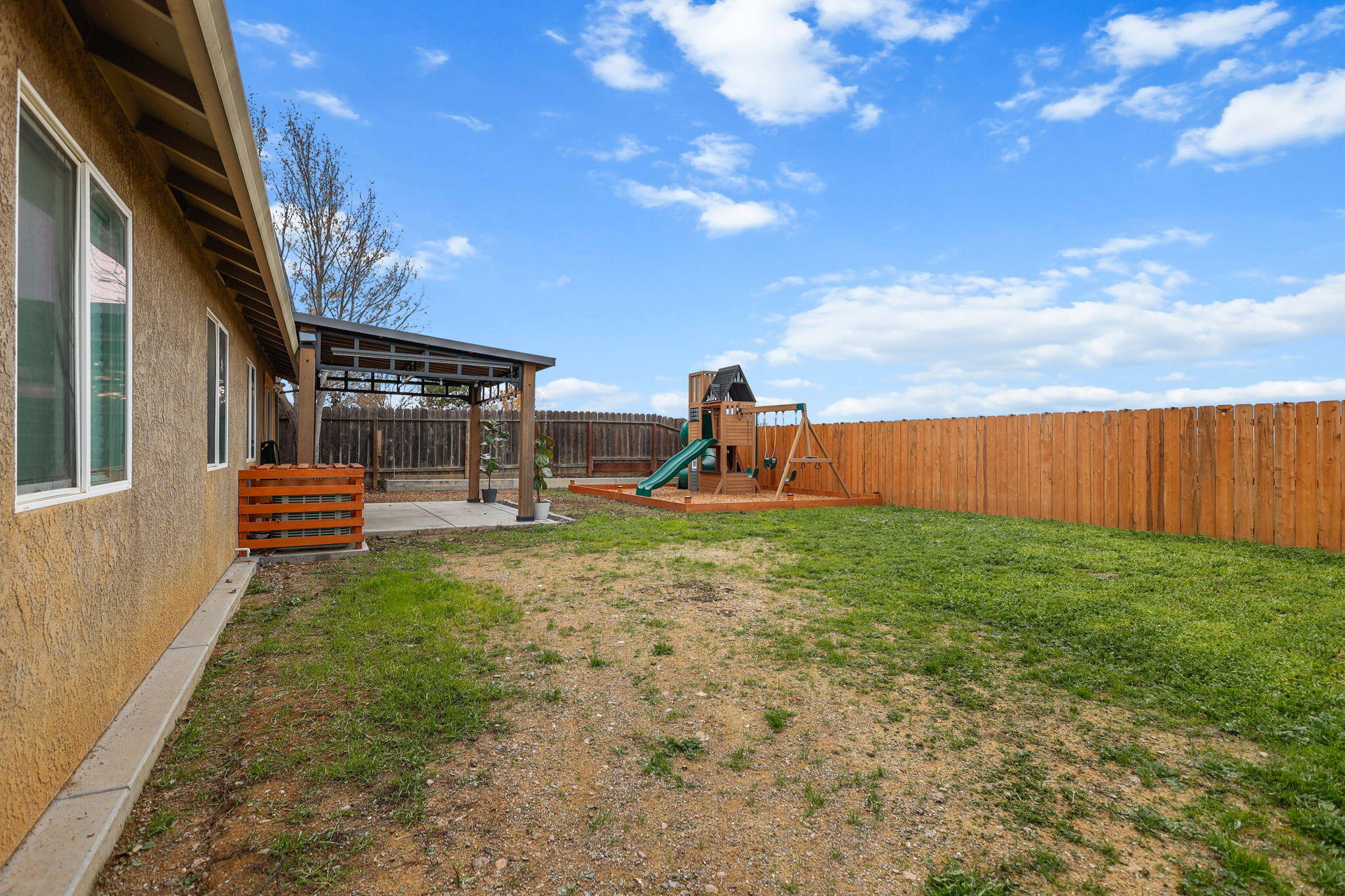 2132 Reta Way Red Bluff, CA 96080 - Photo 32 of 43 a backyard of a house with table and chairs