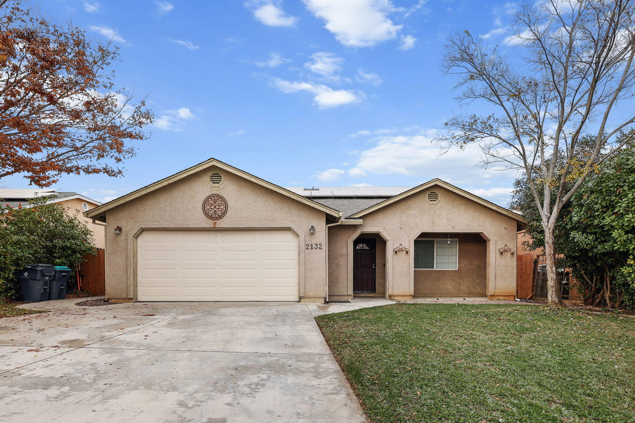 2132 Reta Way Red Bluff, CA 96080 - Photo 42 of 43 a view of a white house with a yard and large tree