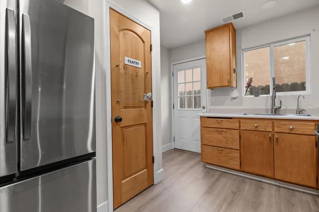 a bathroom with a double vanity sink and mirror