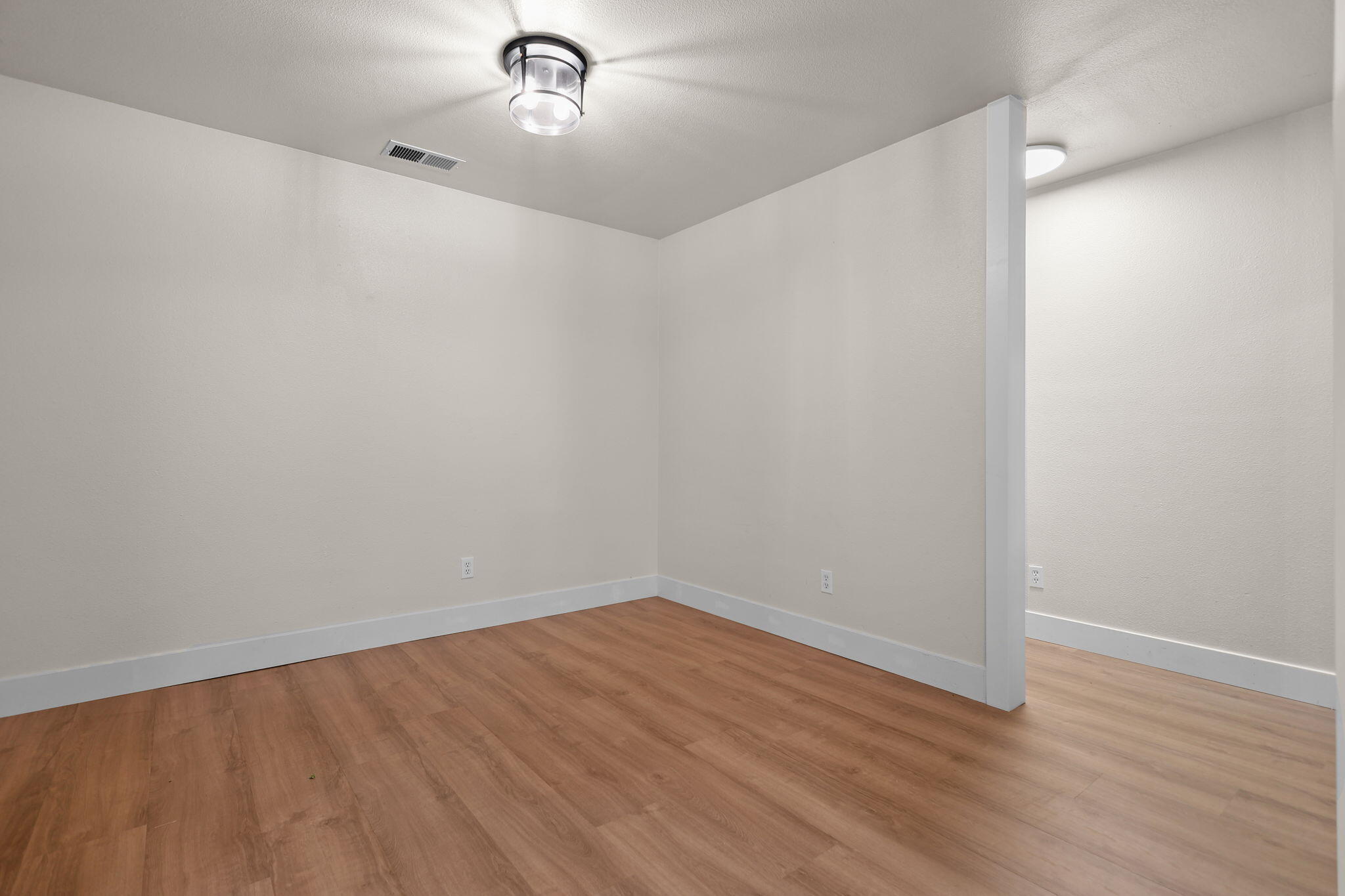 2132 Reta Way Red Bluff, CA 96080 - Photo 9 of 43 a view of a room with wooden floor