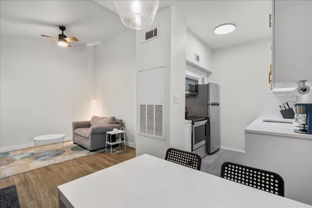 a bedroom with furniture and wooden floor