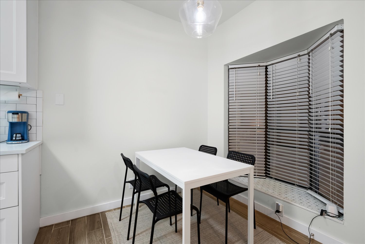 3316 Guadalupe Street, Unit 310 Austin, TX 78705 - Photo 12 of 38 Dining space with wood finished floors and baseboards