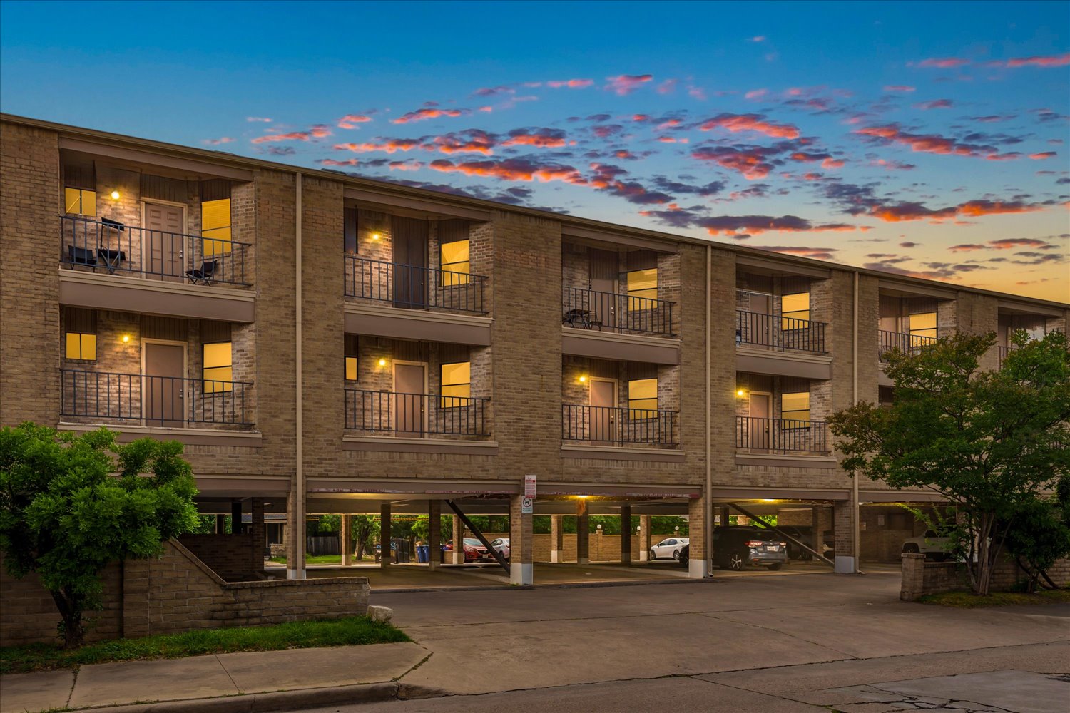 3316 Guadalupe Street, Unit 310 Austin, TX 78705 - Photo 2 of 38 Property at dusk with covered parking