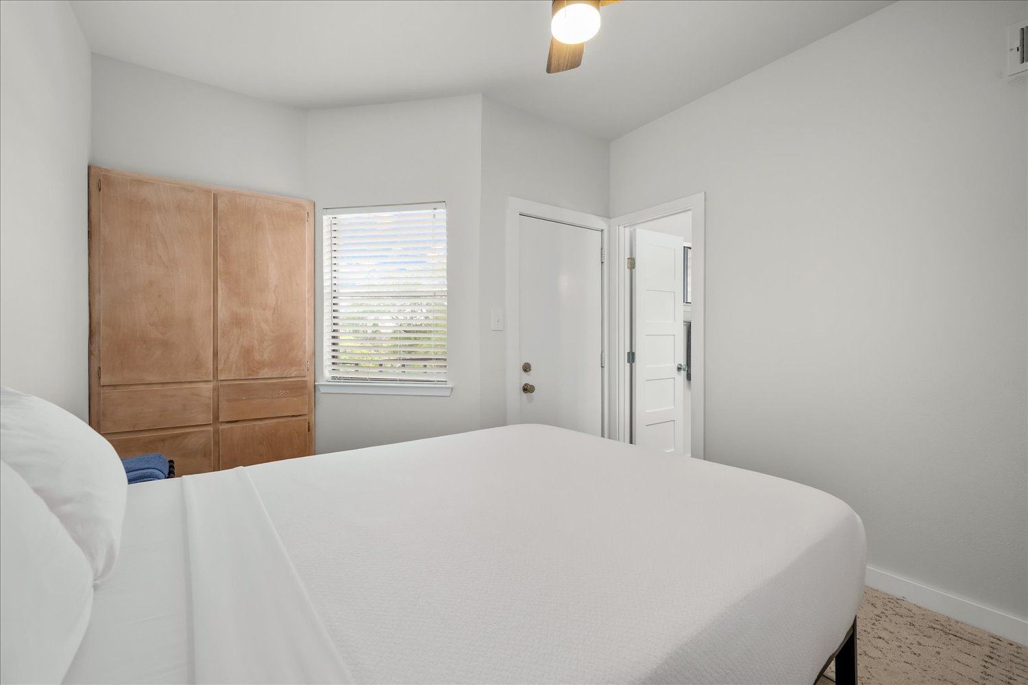 3316 Guadalupe Street, Unit 310 Austin, TX 78705 - Photo 22 of 38 Bedroom with baseboards and ceiling fan