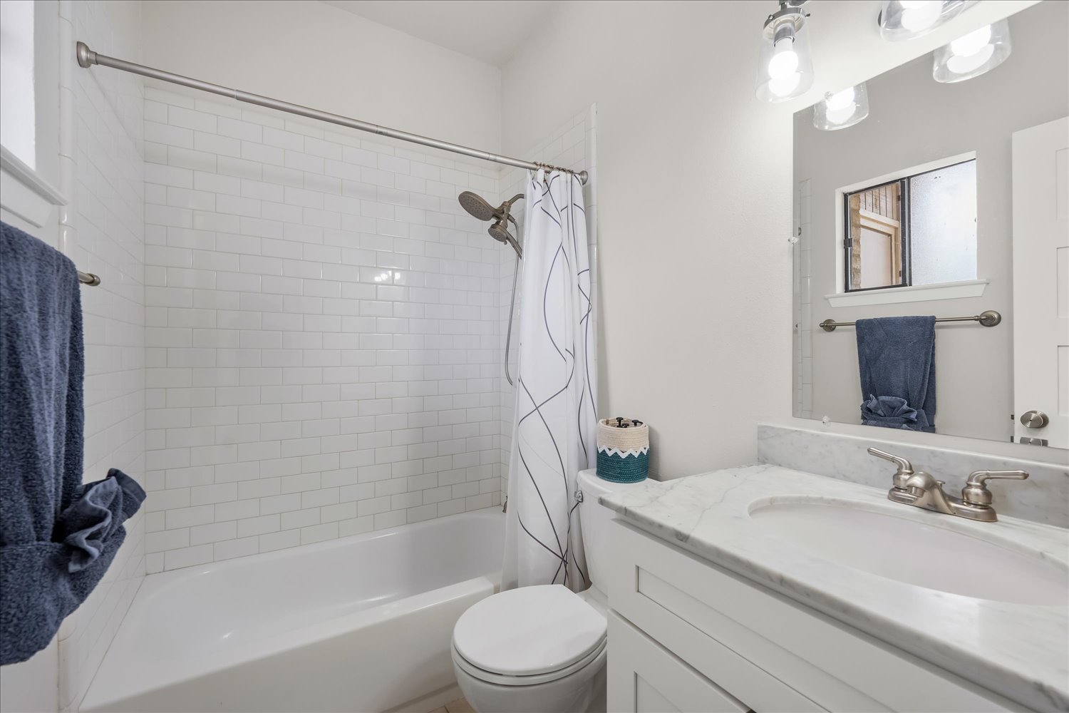 3316 Guadalupe Street, Unit 310 Austin, TX 78705 - Photo 24 of 38 Full bathroom featuring vanity and shower / bathtub combination with curtain