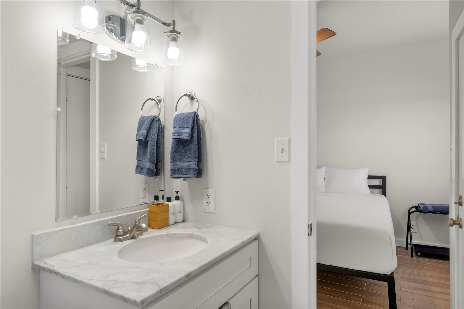 3316 Guadalupe Street, Unit 310 Austin, TX 78705 - Photo 25 of 38 Bathroom with vanity and wood finished floors