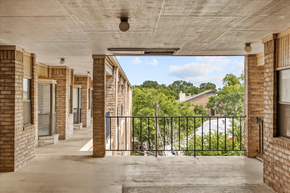 3316 Guadalupe Street, Unit 310 Austin, TX 78705 - Photo 29 of 38 a view of a brick house with a large window