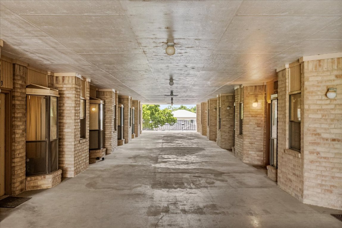 3316 Guadalupe Street, Unit 310 Austin, TX 78705 - Photo 30 of 38 a view of a porch with a table and chairs