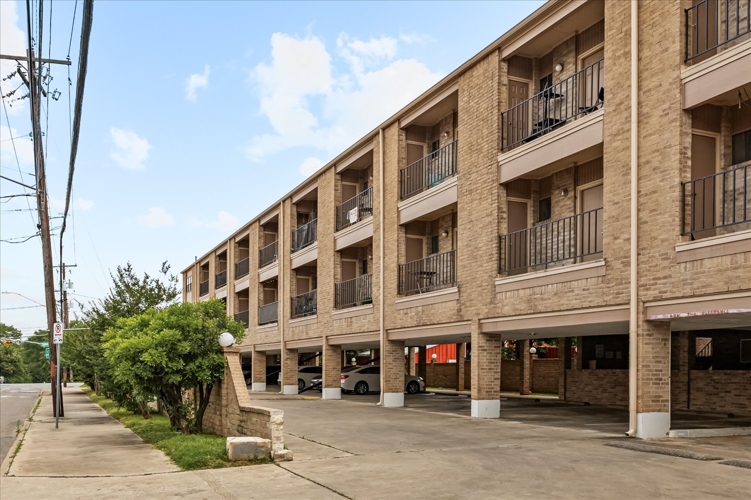 3316 Guadalupe Street, Unit 310 Austin, TX 78705 - Photo 33 of 38 View of apartment building / complex featuring covered parking
