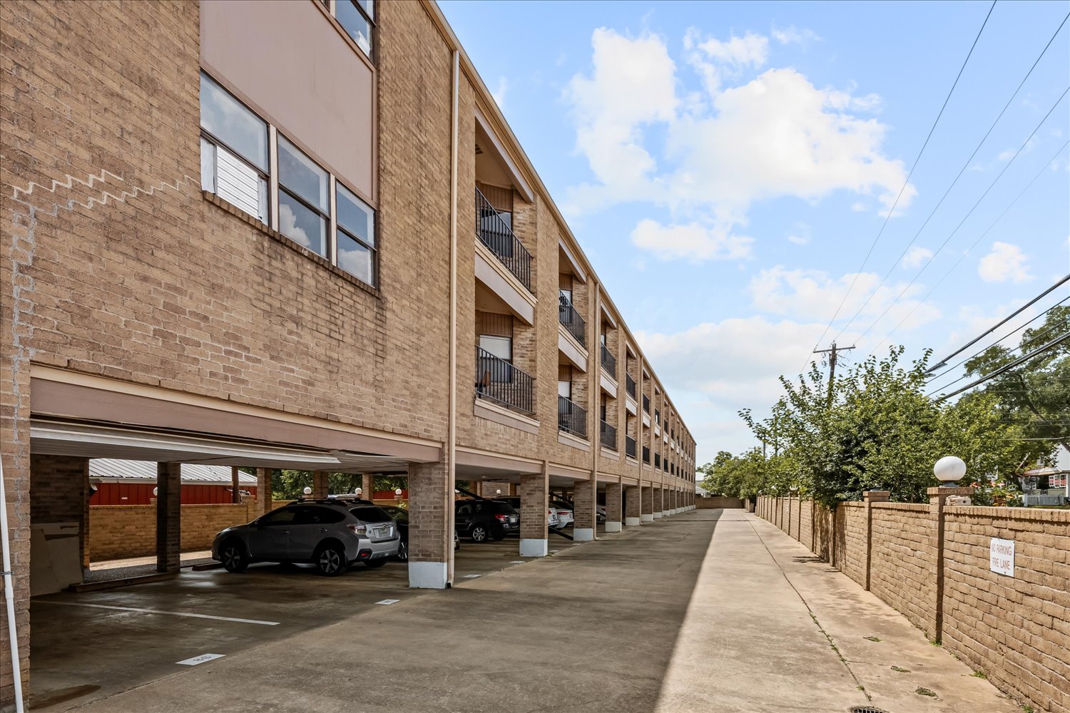 3316 Guadalupe Street, Unit 310 Austin, TX 78705 - Photo 37 of 38 View of building exterior with covered parking