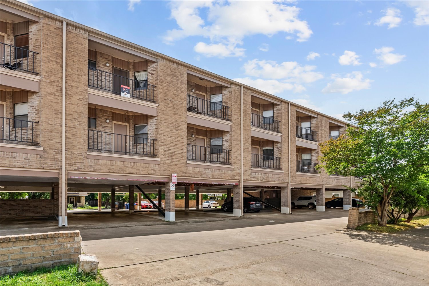 3316 Guadalupe Street, Unit 310 Austin, TX 78705 - Photo 38 of 38 View of apartment building / complex with covered parking