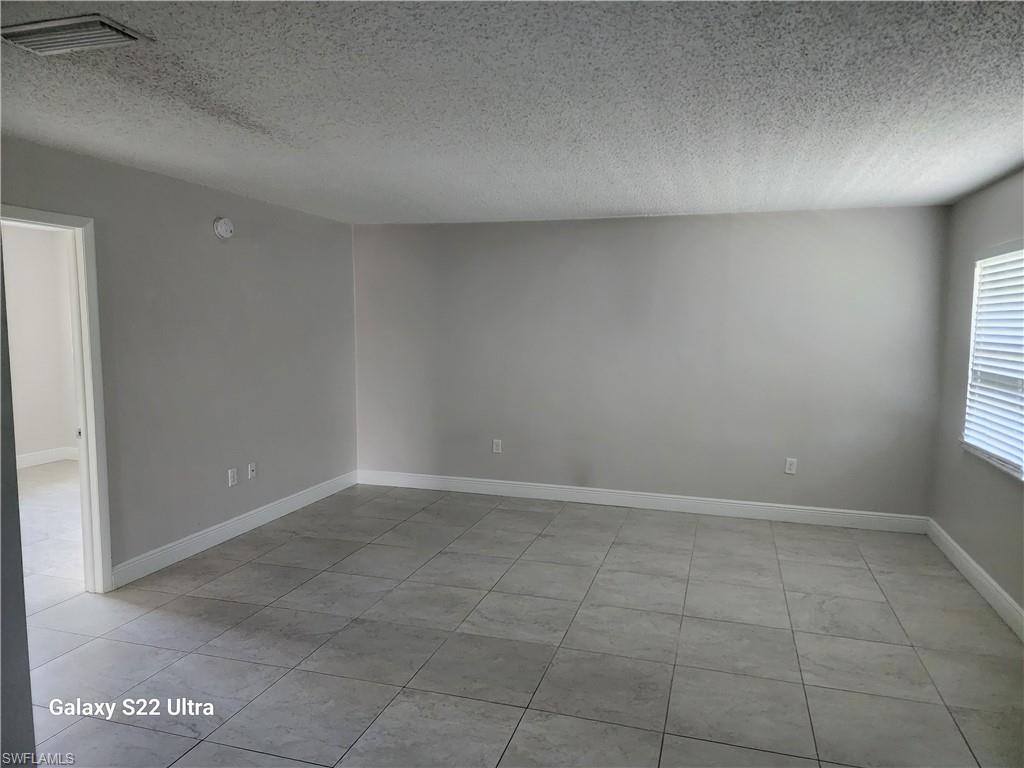 3325 Airport Road North, Unit N8 Naples, FL 34105 - Photo 8 of 22 a view of an empty room and a window