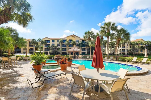 a view of a patio with swimming pool