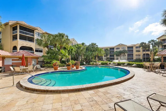 a view of a swimming pool with a patio