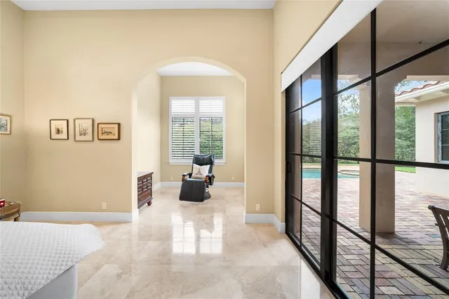a view of living room with furniture and potted plants