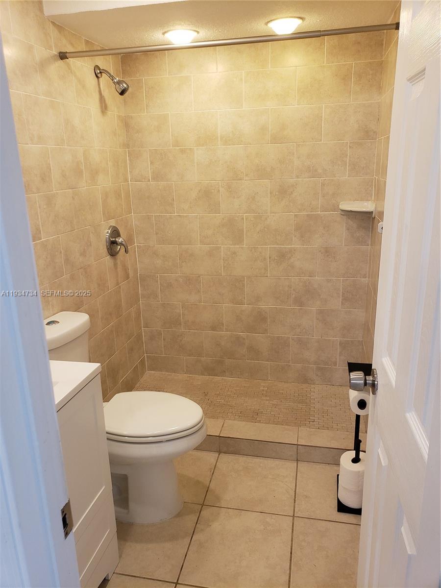 200 South Birch Road, Unit 203 Fort Lauderdale, FL 33316 - Photo 9 of 10 a bathroom with a toilet and a shower
