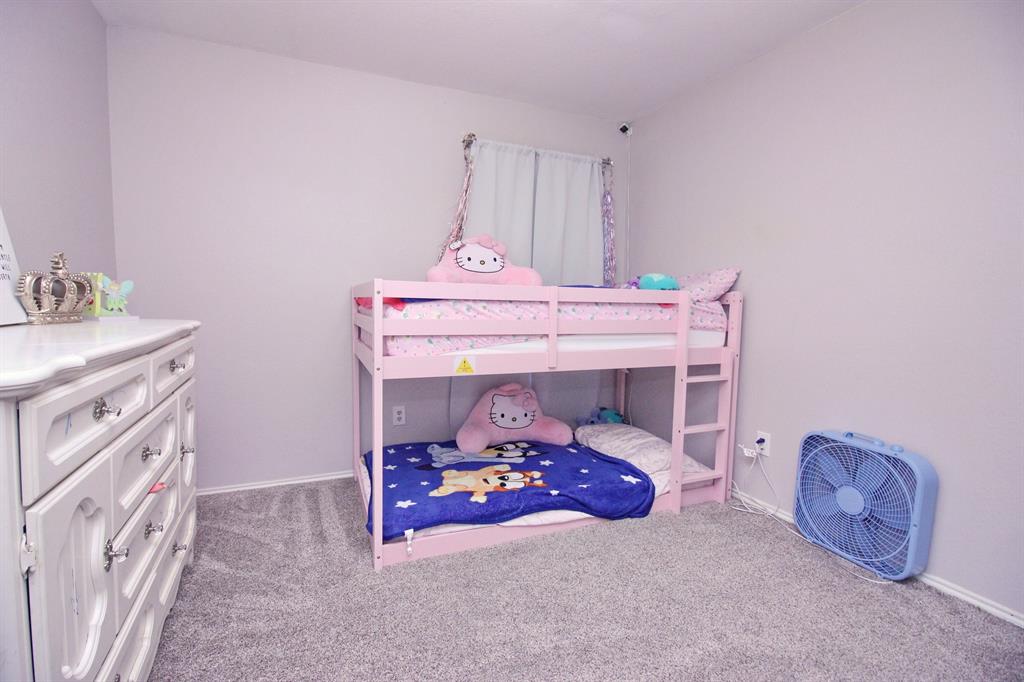 12609 Carpenter Lane Rhome, TX 76078 - Photo 9 of 29 Gray-toned carpeting, light-colored walls, and a window with curtains