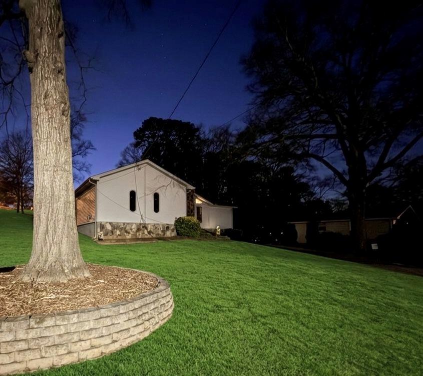 a front view of a house with a garden