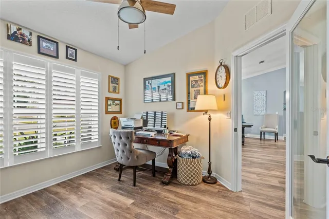 a bedroom with a bed a dresser and a window