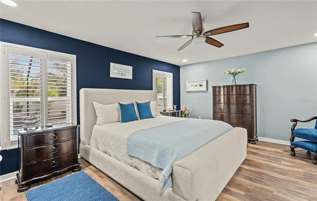a white toilet sitting next to a bathroom sink